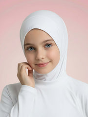 Young girl wearing a white hijab against a pink background