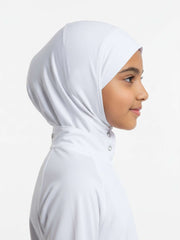 Young girl wearing a white hijab and shirt on a light gray background