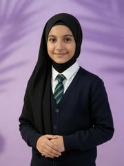 Person wearing a black hijab, dark cardigan, and striped tie against a purple background