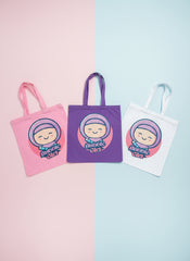 Three tote bags in pink, purple, and white with a cartoon character and 'Bunni Girl' text on a pastel background. Bubble Girl hijab