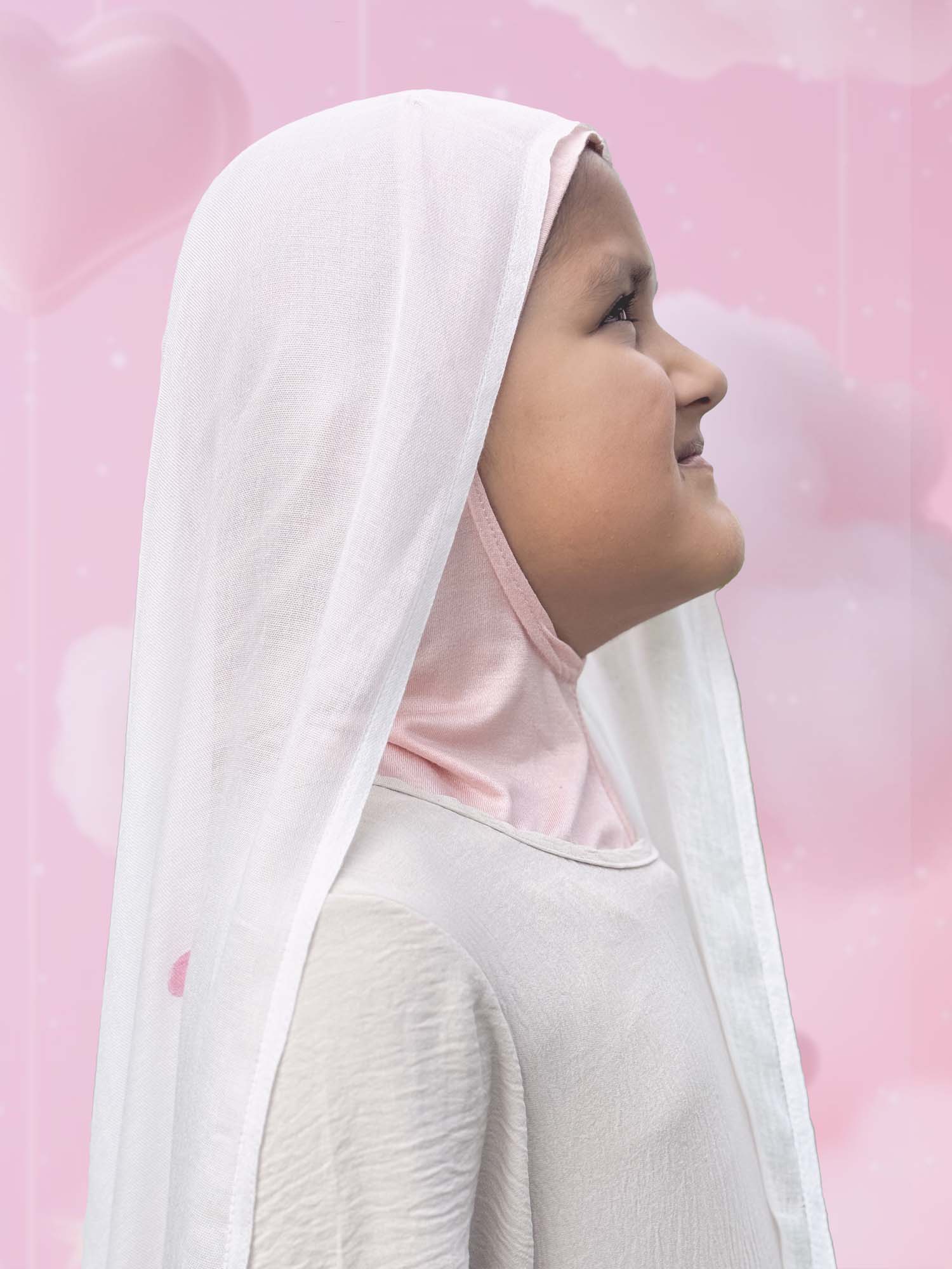Close-up of modal instant hijab for girls in white with pink hearts