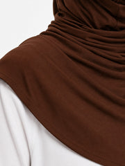 Close up of the dark brown cotton jersey fabric and gathered drape of the FitWrap hijab