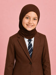 Girl in a brown school blazer and striped tie wearing the Cocoa Crumble brown school hijab
