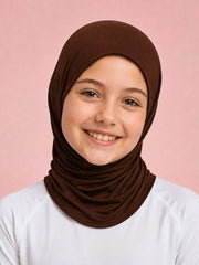 Girl wearing the Cocoa Crumble dark brown FitWrap instant sports hijab with a white top