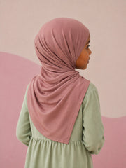 Back view of the dusty rose jersey hijab for girls, showing the draped tail