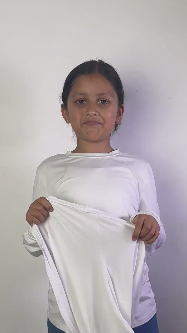 A girl pulls the FeatherLite instant hijab for girls on over her head in one movement