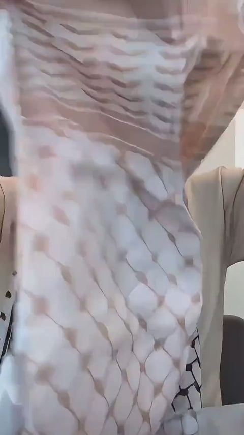 Beige and white keffiyeh fabric, close up