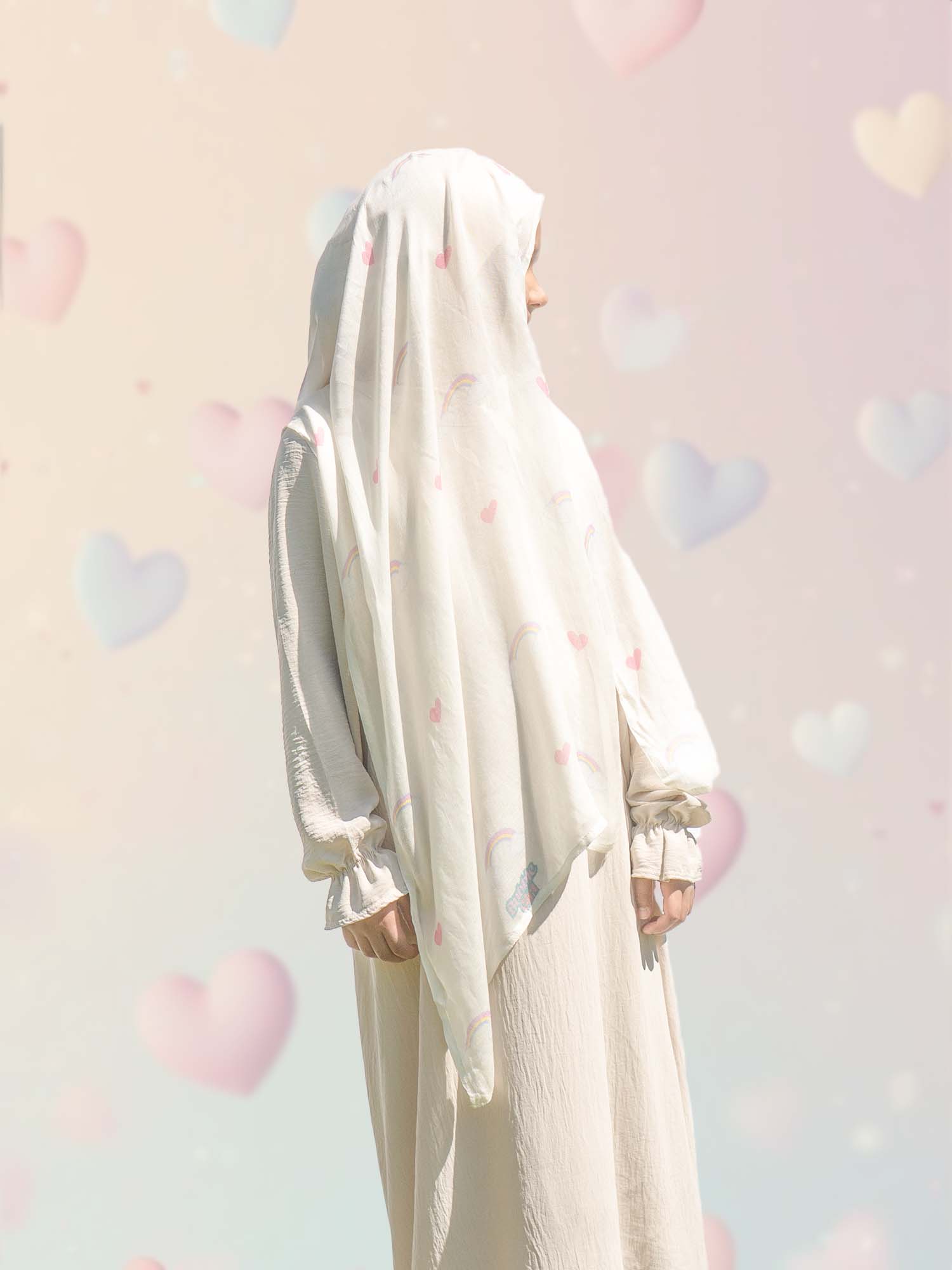 Side profile of girl wearing Bubble Girl pastel rainbow modal instant hijab, showing smooth drape and secure built-in undercap