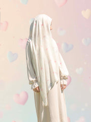 Side profile of girl wearing Bubble Girl pastel rainbow modal instant hijab, showing smooth drape and secure built-in undercap