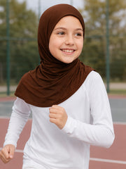 Girl running on a school track in the Cocoa Crumble brown sports hijab for PE